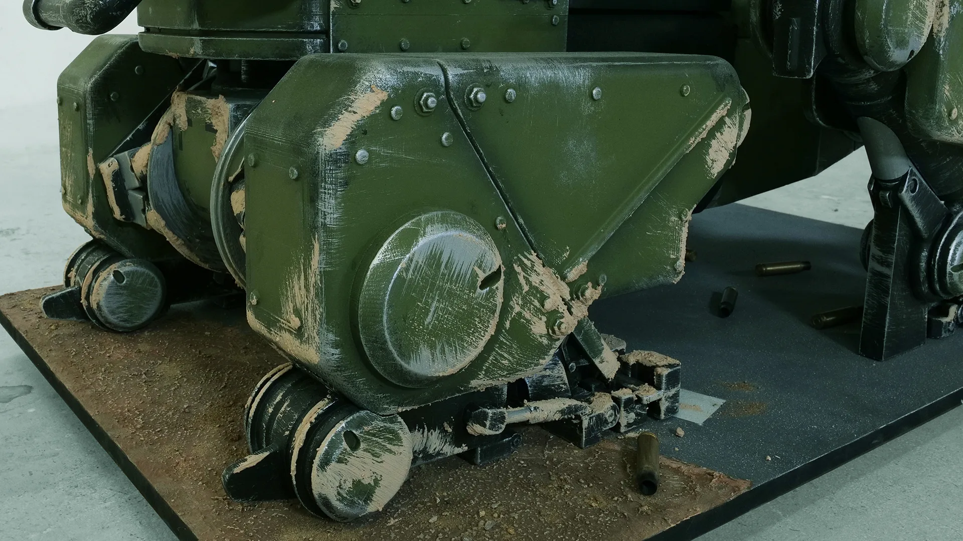 Legs and base with mud, dust and spent casings