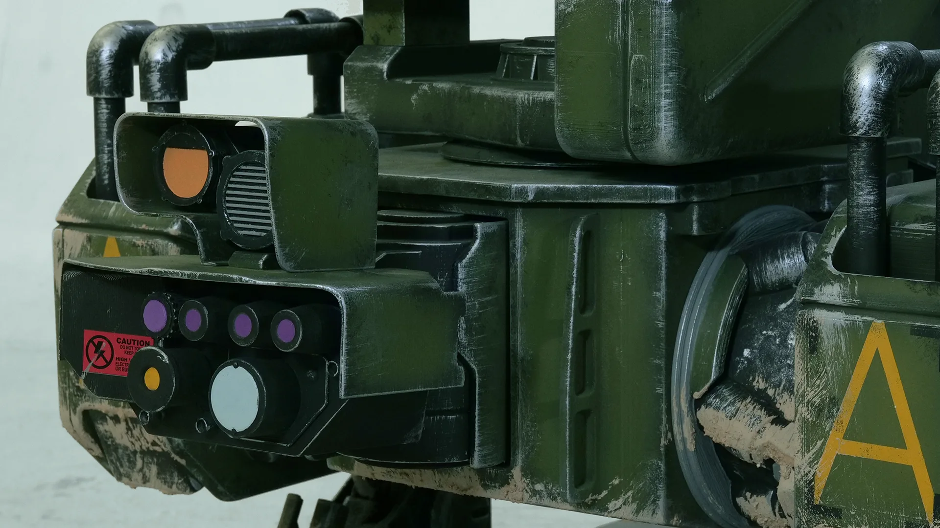 Optics and caution markings on the front module