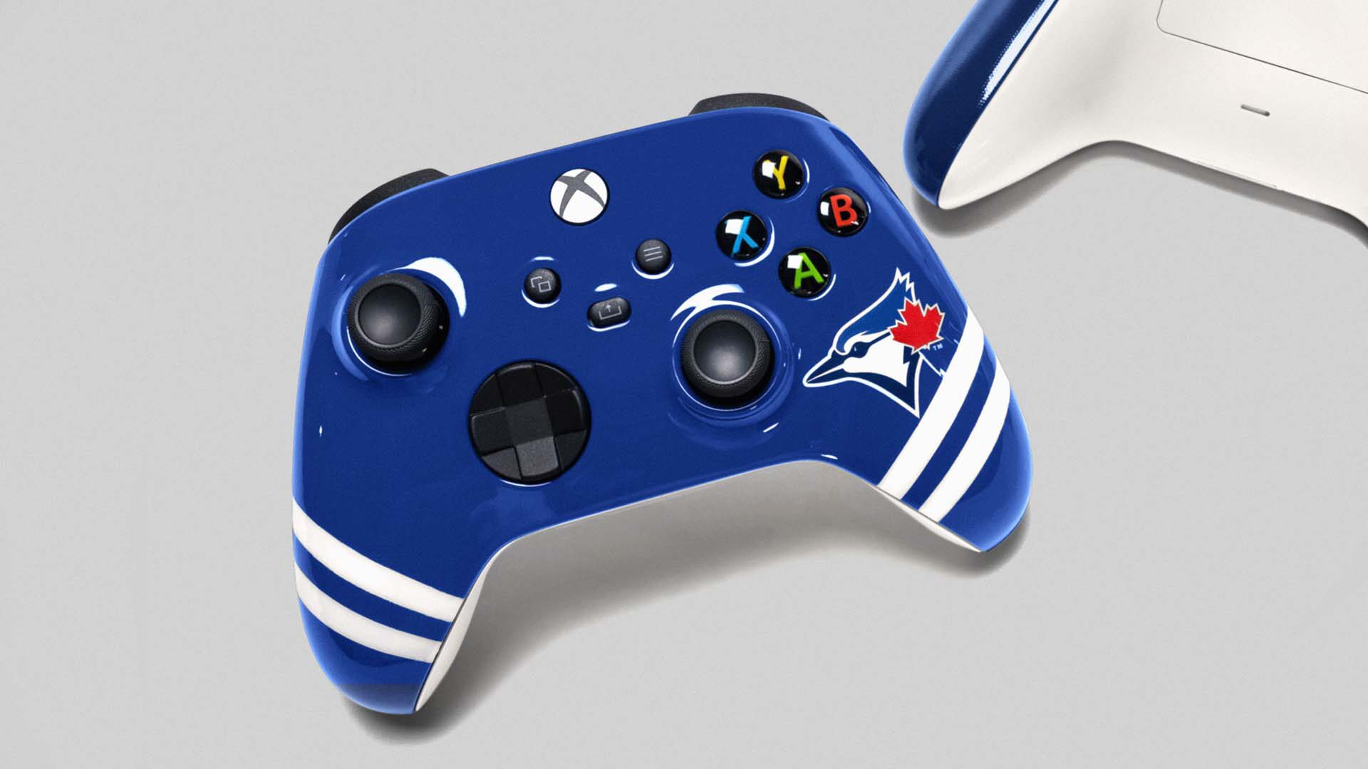 Toronto Blue Jays themed Xbox controller in royal blue with white stripes