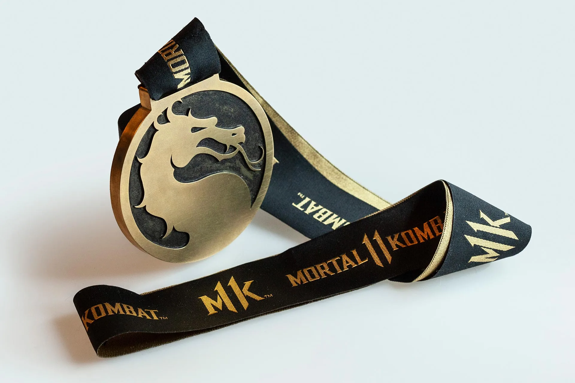 Brass dragon medal on a Mortal Kombat 11 ribbon
