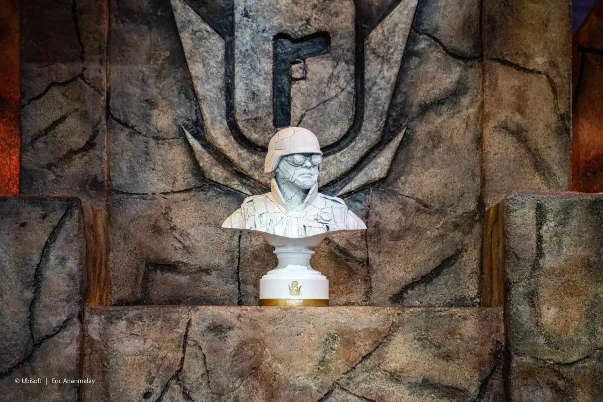 The finished trophy displayed in front of the Rainbow Six emblem